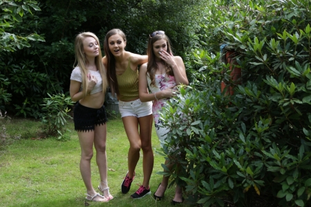 Clothed women catching a naked man outdoors - public CFNM scene